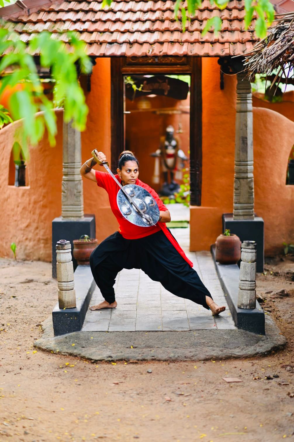 Rathi Priya training with a sword and shield at the Gurukulam